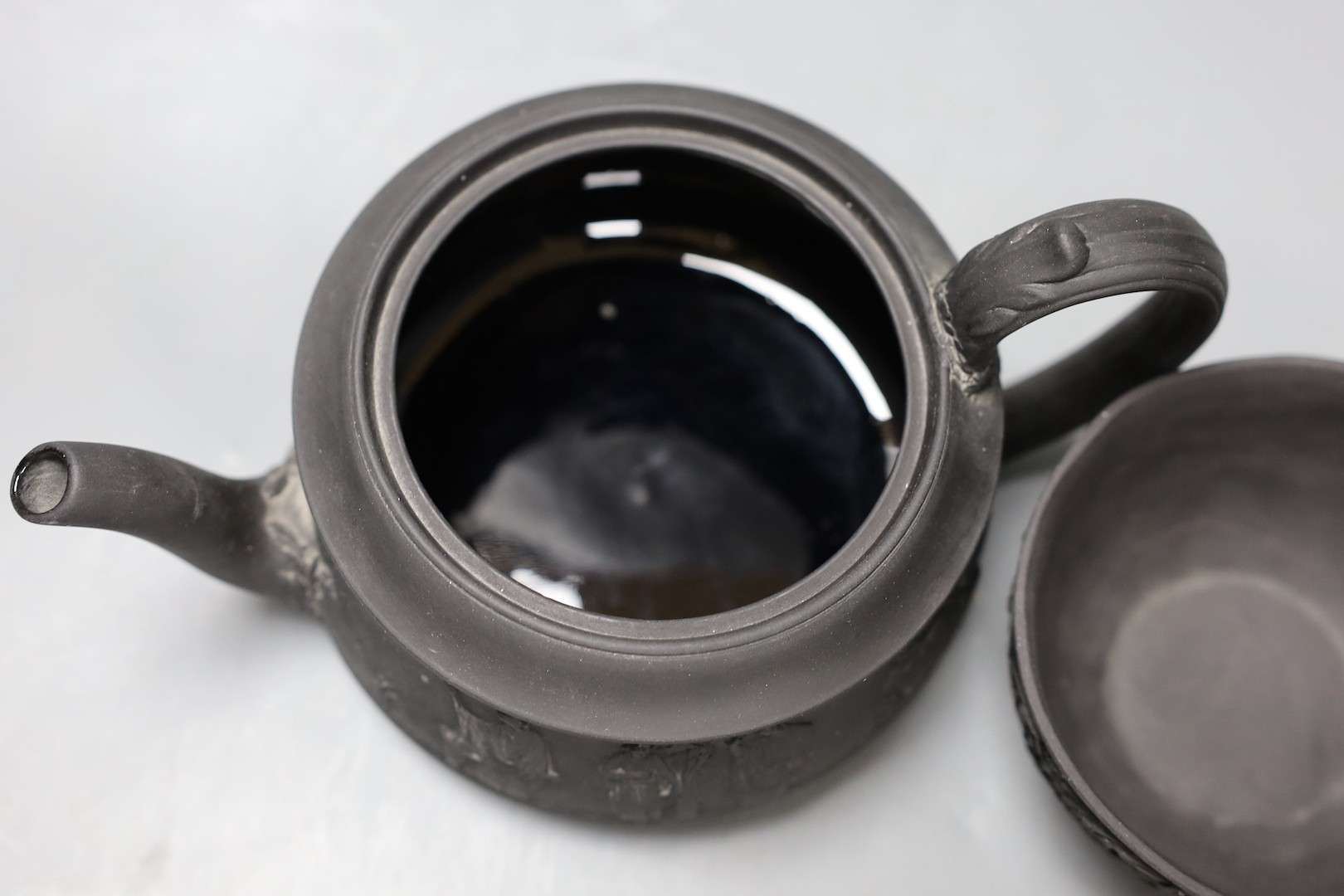 A Wedgwood black basalt 'Union' sugar bowl, early 19th century and a teapot and cover 10cm tall